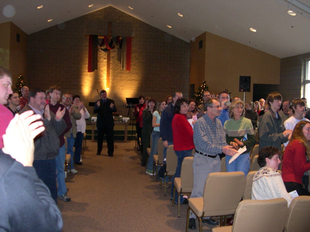 Post 9/11 memories - church members clap.