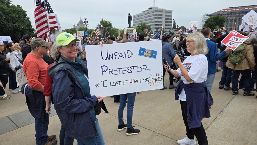 I like this sign at the No Kings rally. Nobody paid me, either.