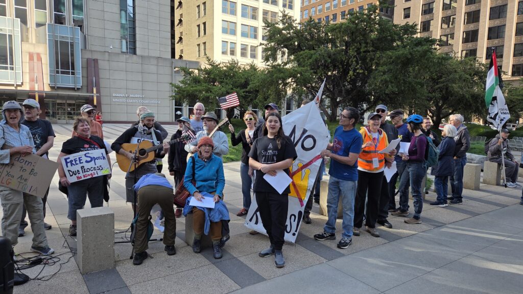 Zeke joining in the singing at the Minneapolis No Kings rally, Saturday, October 18, 2025.