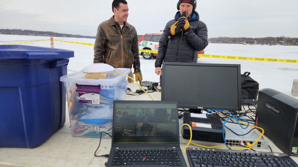 Cyber thriller author Greg Scott's live video conferencing setup on a frozen Minnesota lake with an active multi-feed stream getting ready for a Holes 4 Heroes event.